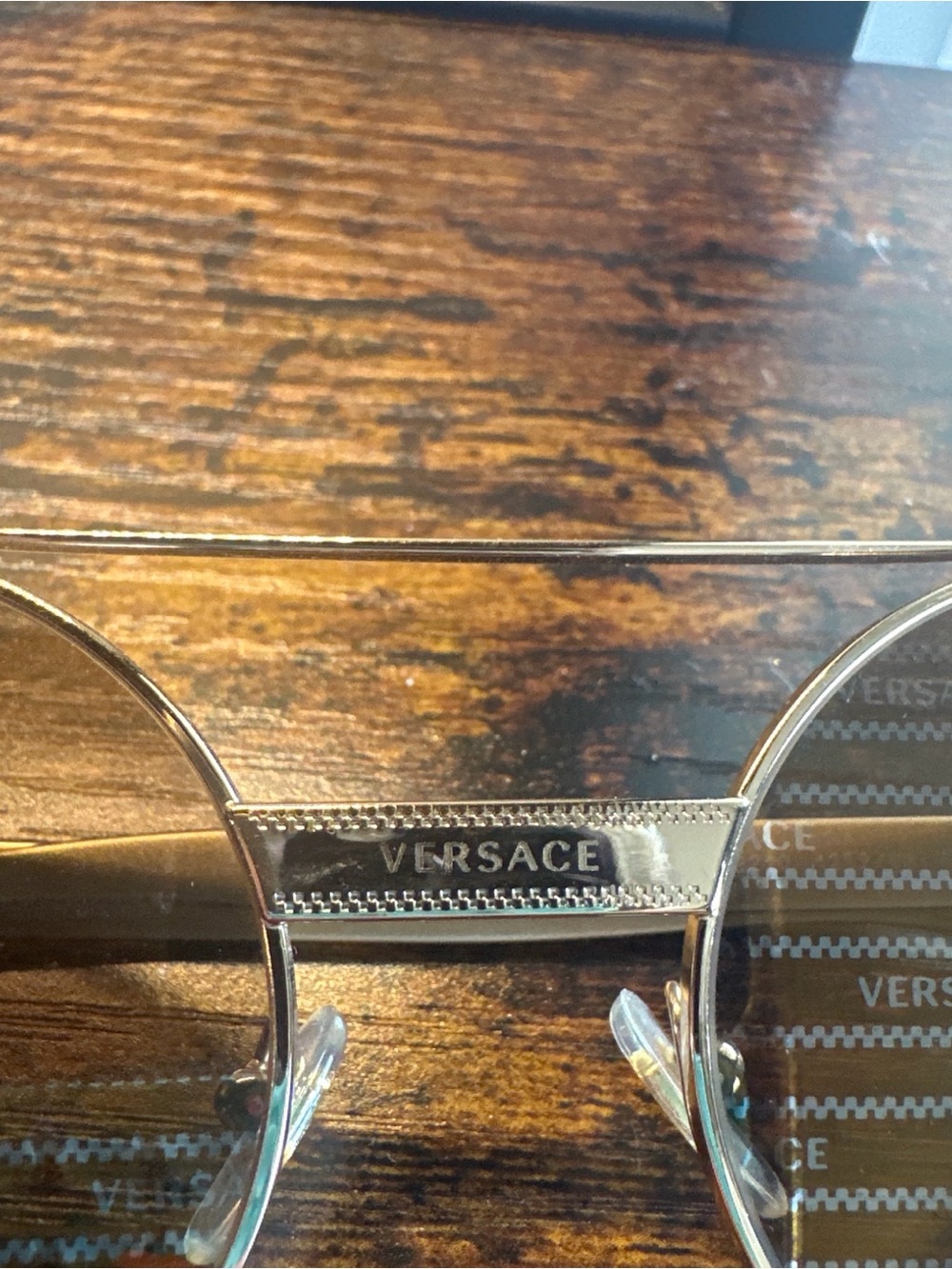 Versace Gold Rimmed Round Metal Accent Display Frame